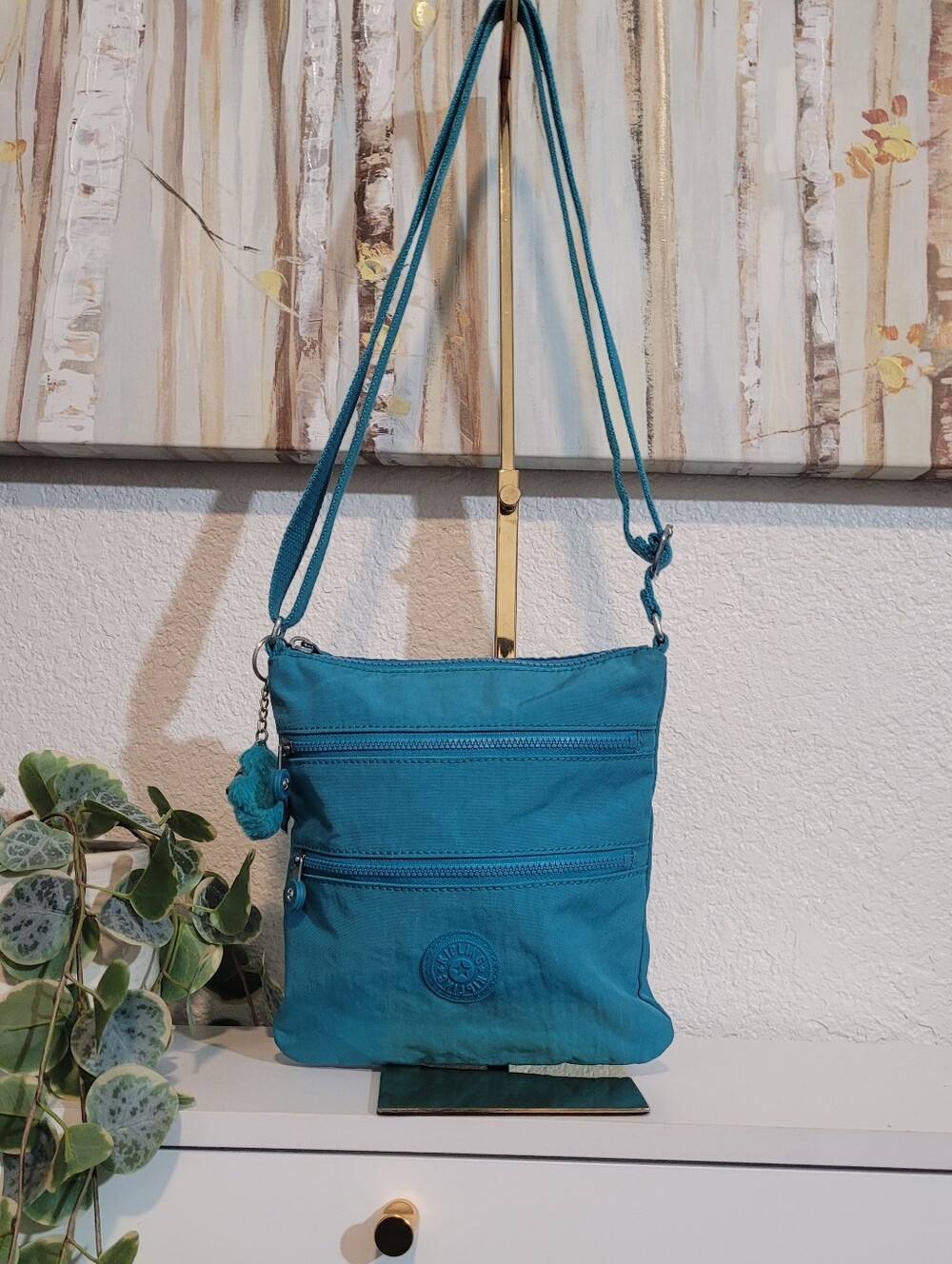 Kipling Alvar Blue Crossbody Bag with Several Zip Pockets And Monkey Charm